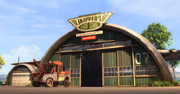 Mater looking at Skipper's Flight School.