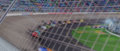 The last eleven racers rounding the final corner, led by Todd "the Shockster" Marcus in thirteenth place.