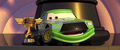 "With Piston Cup" - Chick shows off his questionably-earned trophy to a silent crowd.