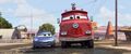 Sally brings Red to hose the cacti off McQueen.
